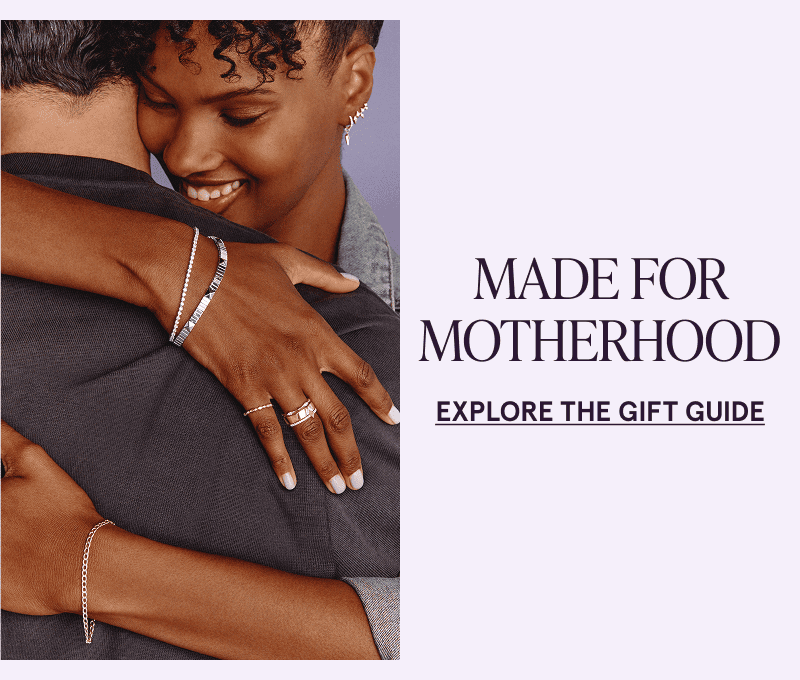 Female embracing with mix-metal & diamond jewelry.  Made for Motherhood. Click here to explore the gift guide