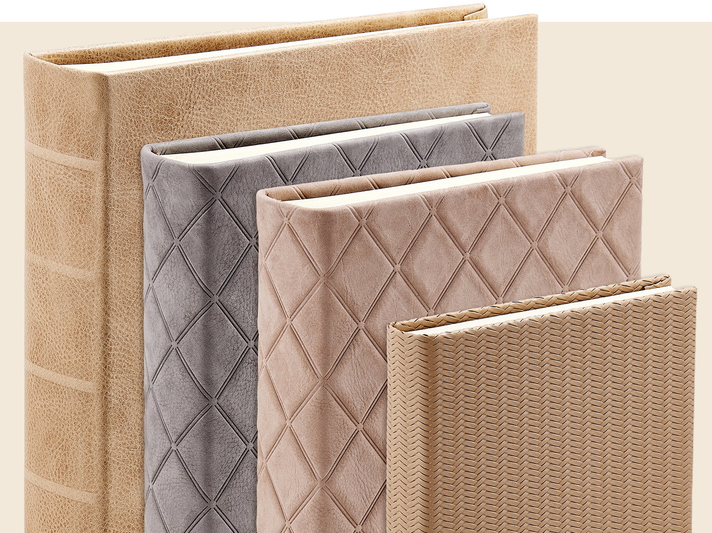 An assortment of leather photo albums in various sizes and finishes.