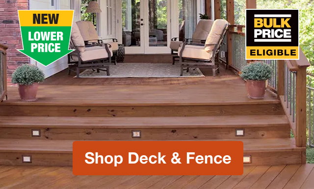 A modern wooden deck with lounge chairs