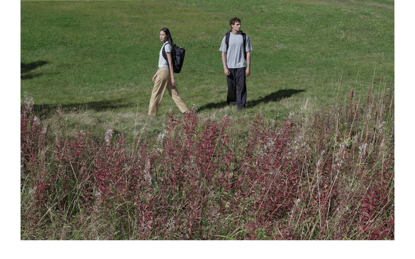 Couple walking in new Tech Lite t-shirts