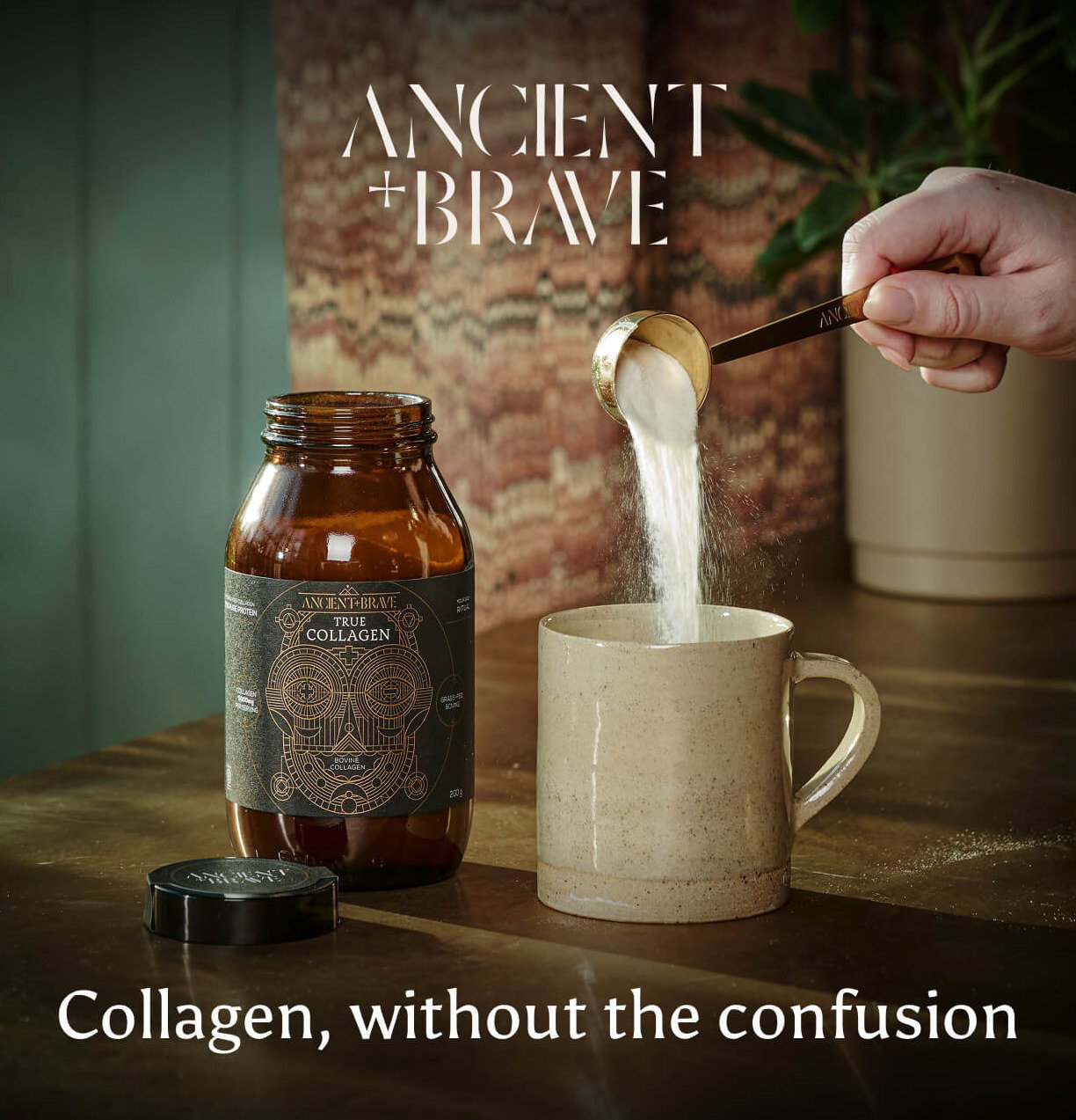 A close up of a handing pouring True Collagen into a mug