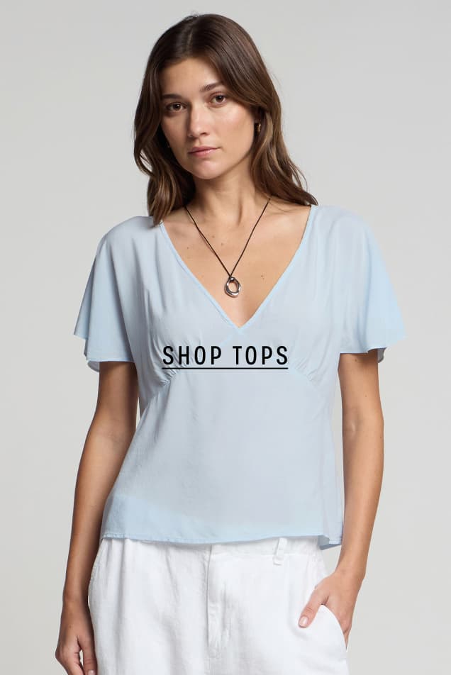 Model wearing Lina Top. SHOP TOPS