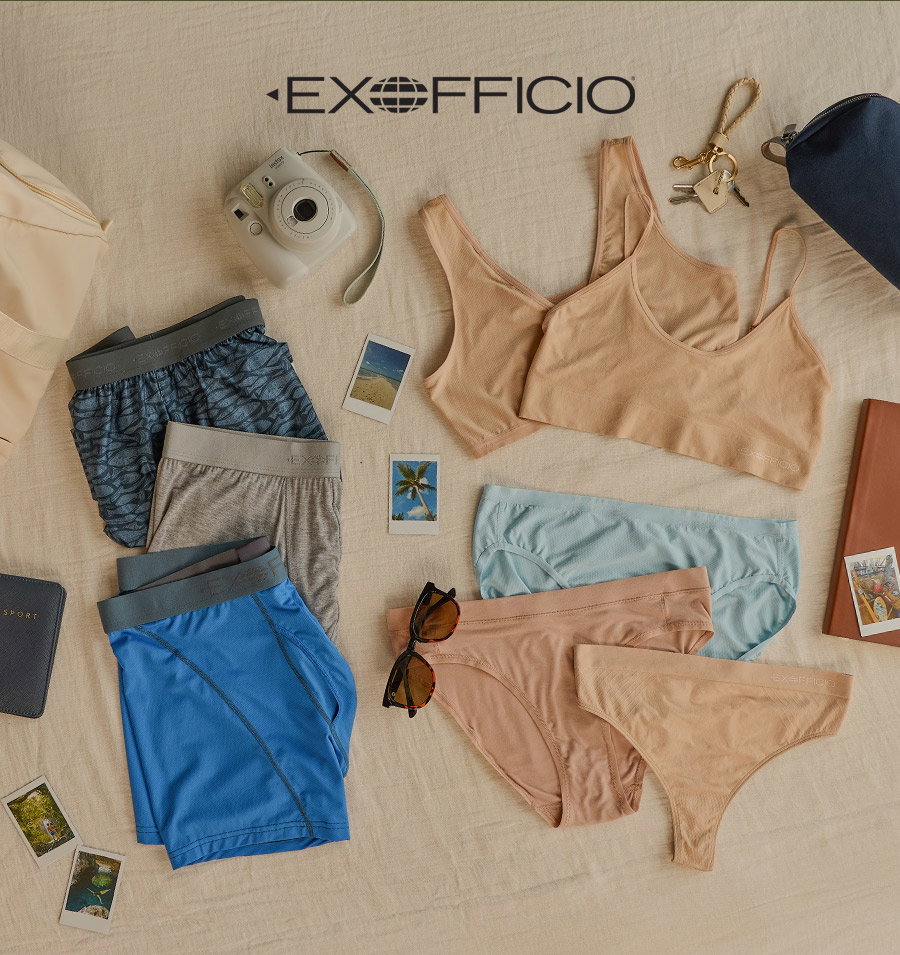 ExOfficio logo above assorted underwear, bras, camera, sunglasses, keys, and travel accessories on a beige surface.