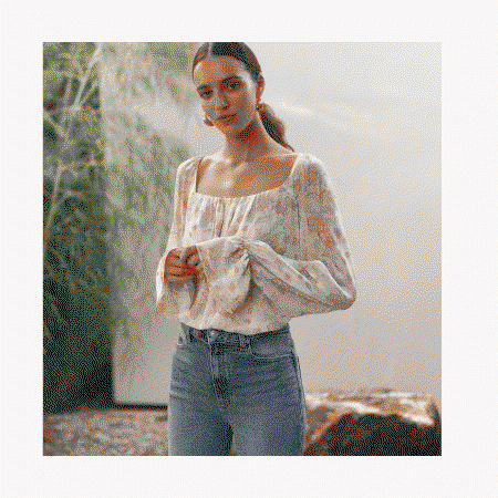 Animated images rotating between a woman wearing a floral blouse and light wash jeans, tan suede loafers, and a white embroidered denim jacket on a wicker chair. 