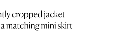 A short-sleeve slightly cropped jacket paired perfectly with a matching mini skirt.