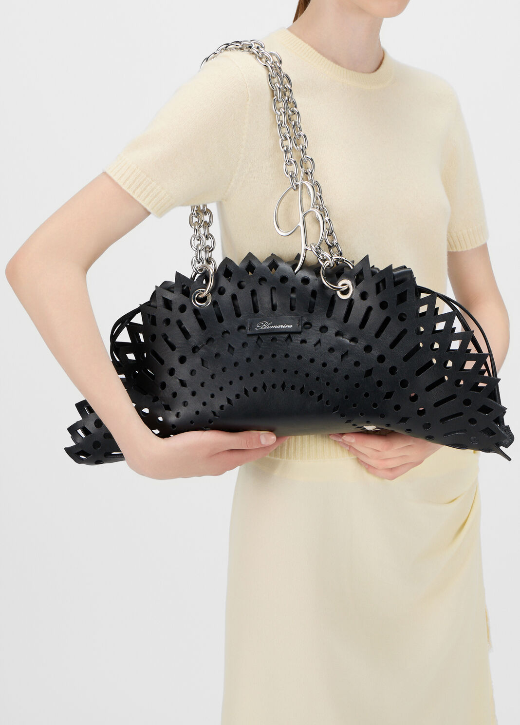 Laser-cut leather shoulder bag