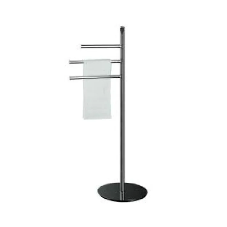 Freestanding chrome towel rail with three horizontal arms, white towel hanging and round black base