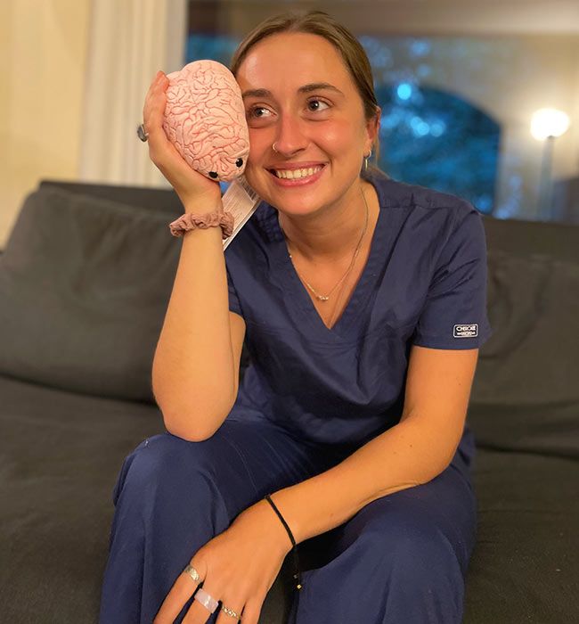 Nurse holding Brain plush