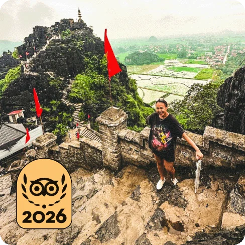 Image Description: A person posing for a photo on the steps of an ancient building. A gold 2026 Travellers’ Choice Best of the Best badge is on the image.