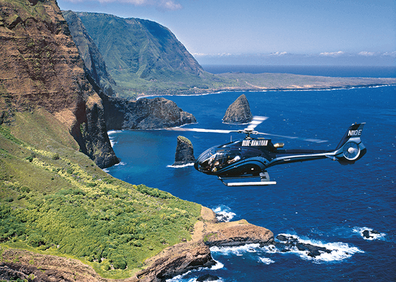 Helicopter flying along Maui’s dramatic coastline.
