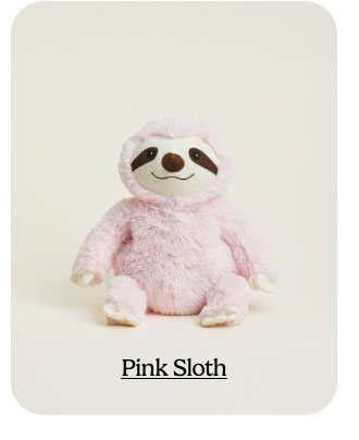 Pink Sloth Warmies on a beige background. Shop Now.