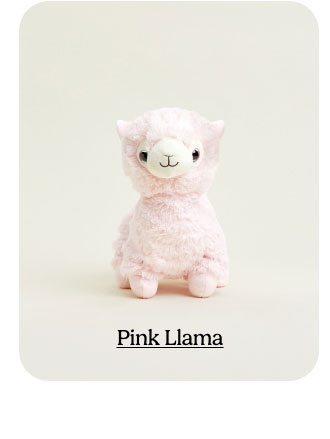 Pink Llama Warmies on a beige background. Shop Now.