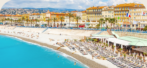 Pebble beach and turquoise water along the Promenade des Anglais in Nice