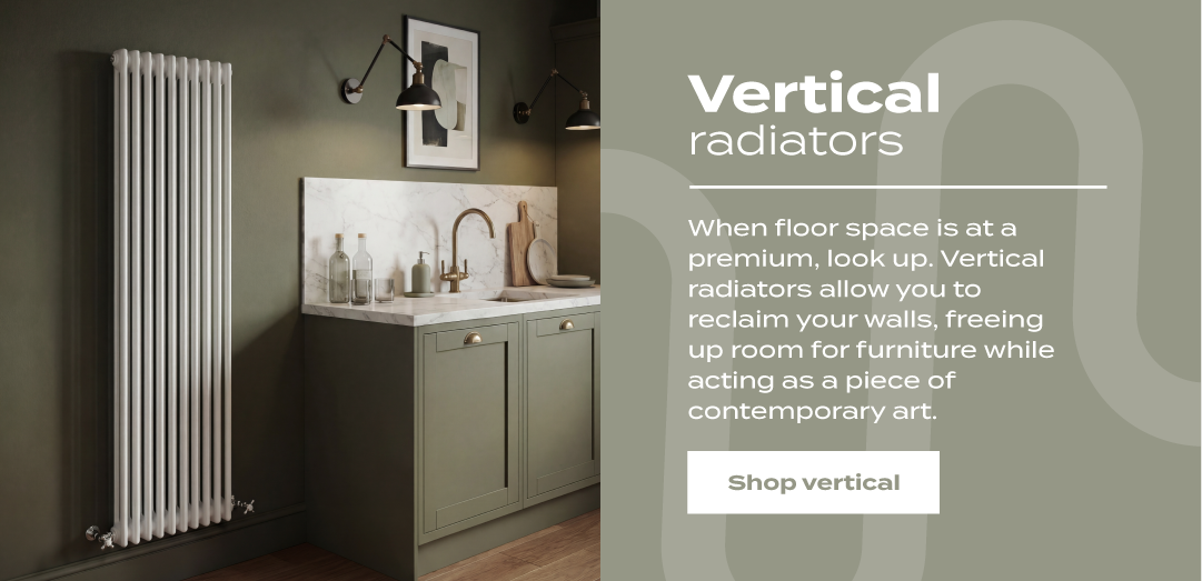 Promotional banner for vertical radiators showing a tall white column radiator in a modern olive-green kitchen interior beside descriptive text about saving floor space, with a ‘Shop vertical’ button.