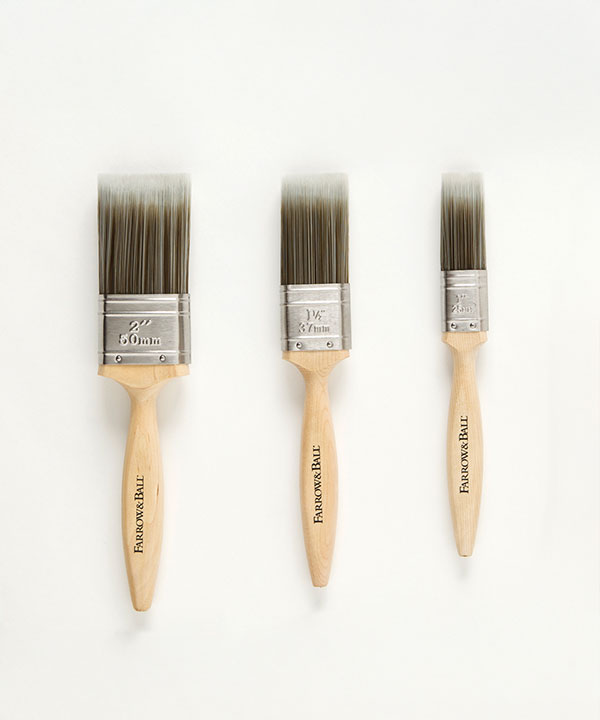 Three Farrow & Ball paint brushes in varying sizes with wooden handles and synthetic bristles.