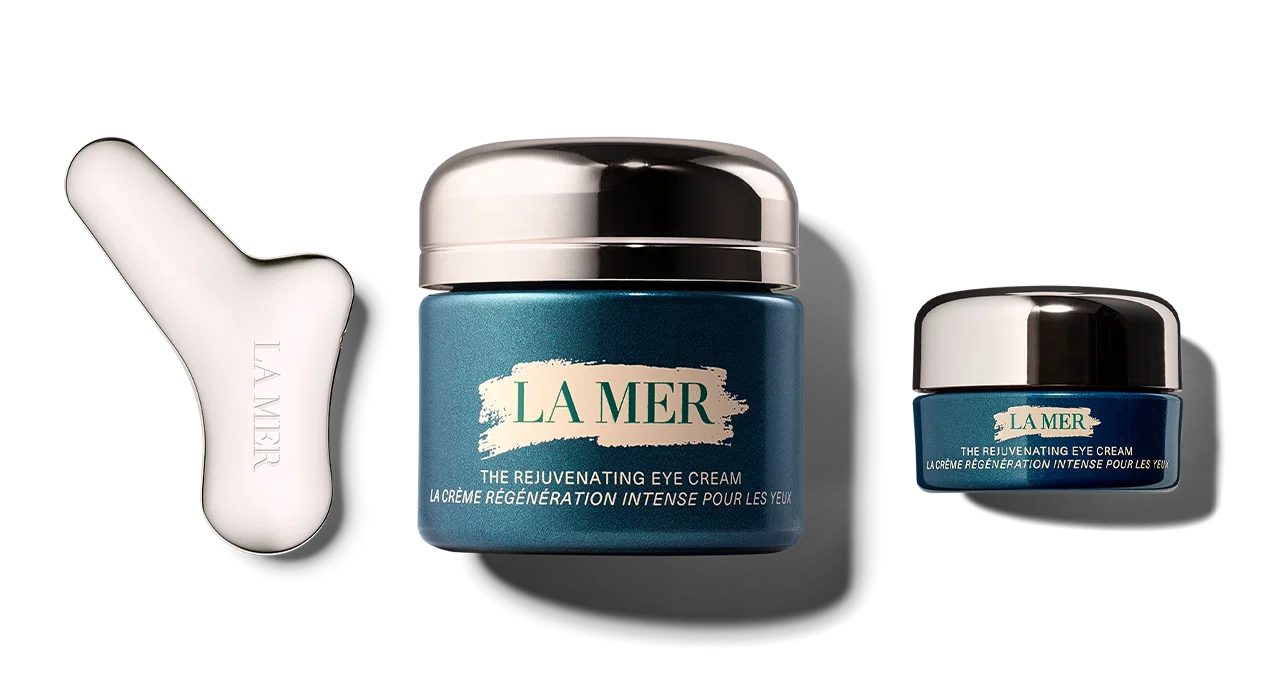 Jar of the new Rejuvenating Eye Cream with the Rejuvenating Eye Tool on the left.
