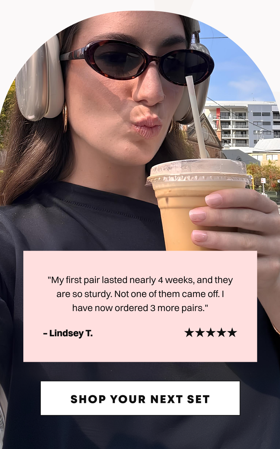 Woman with sunglasses holding iced coffee showing pink nails with customer review