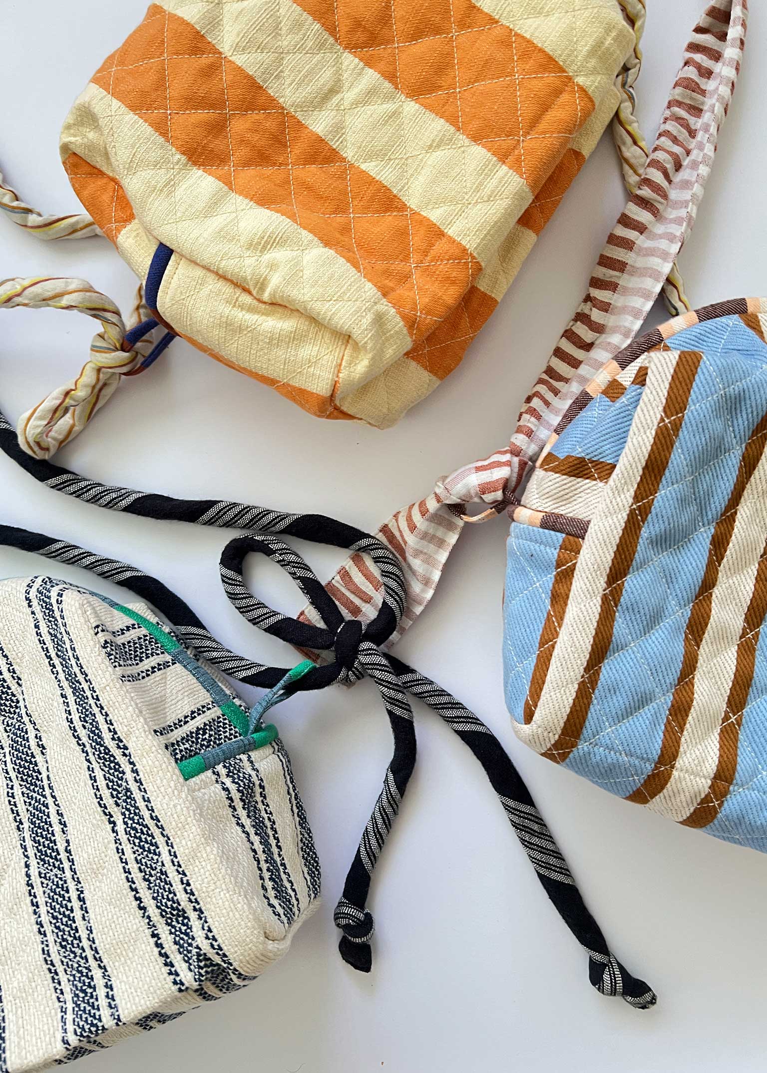 quilted pouches w/ straps attached