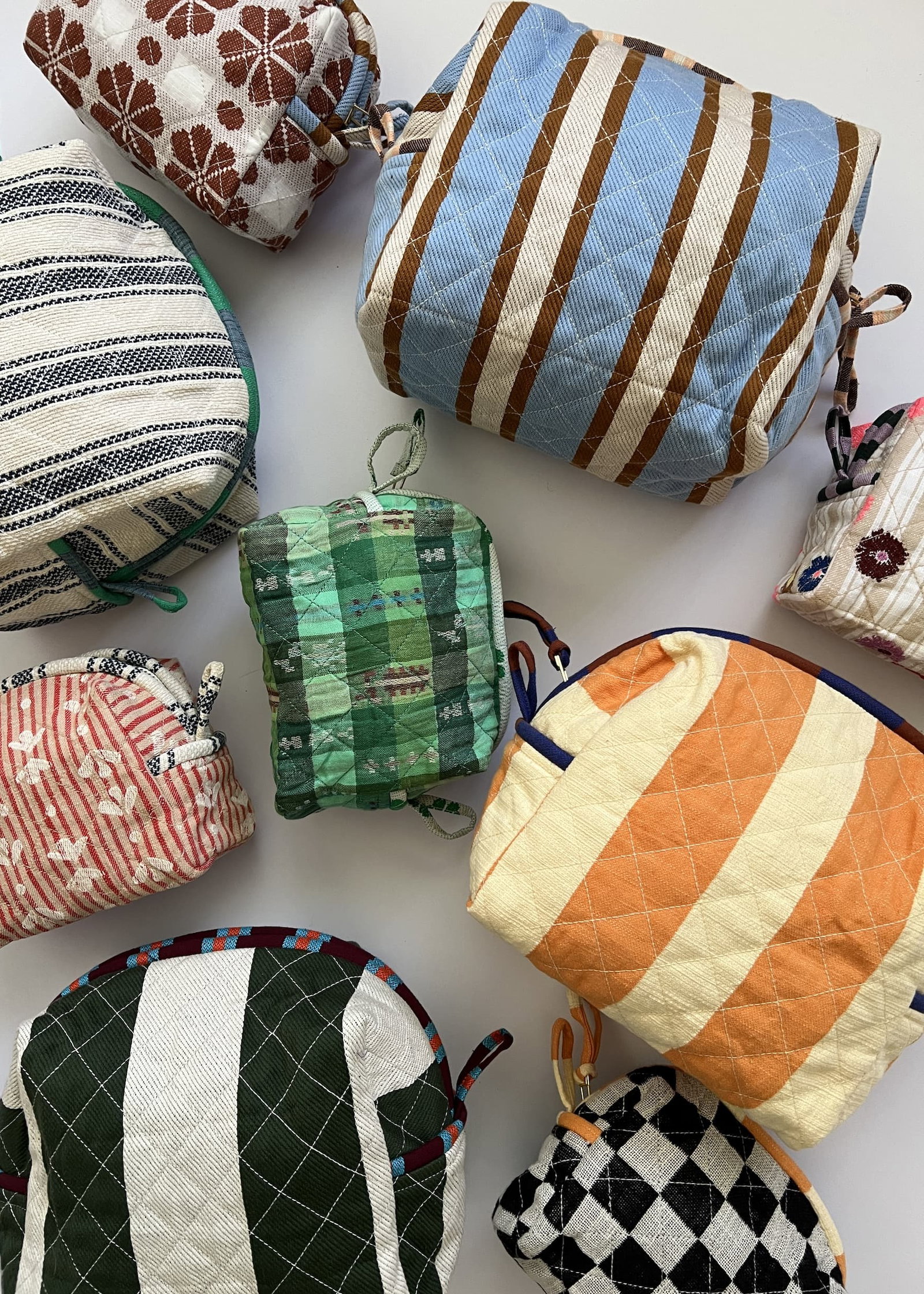 various colorful quilted pouches