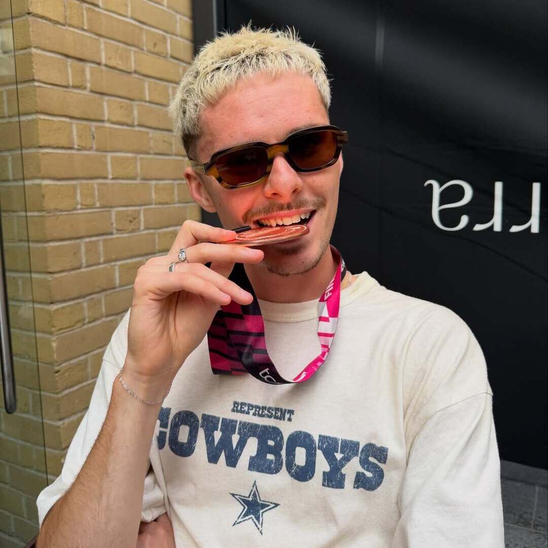 Alfie Manthorpe posing with his London Marathon Medal