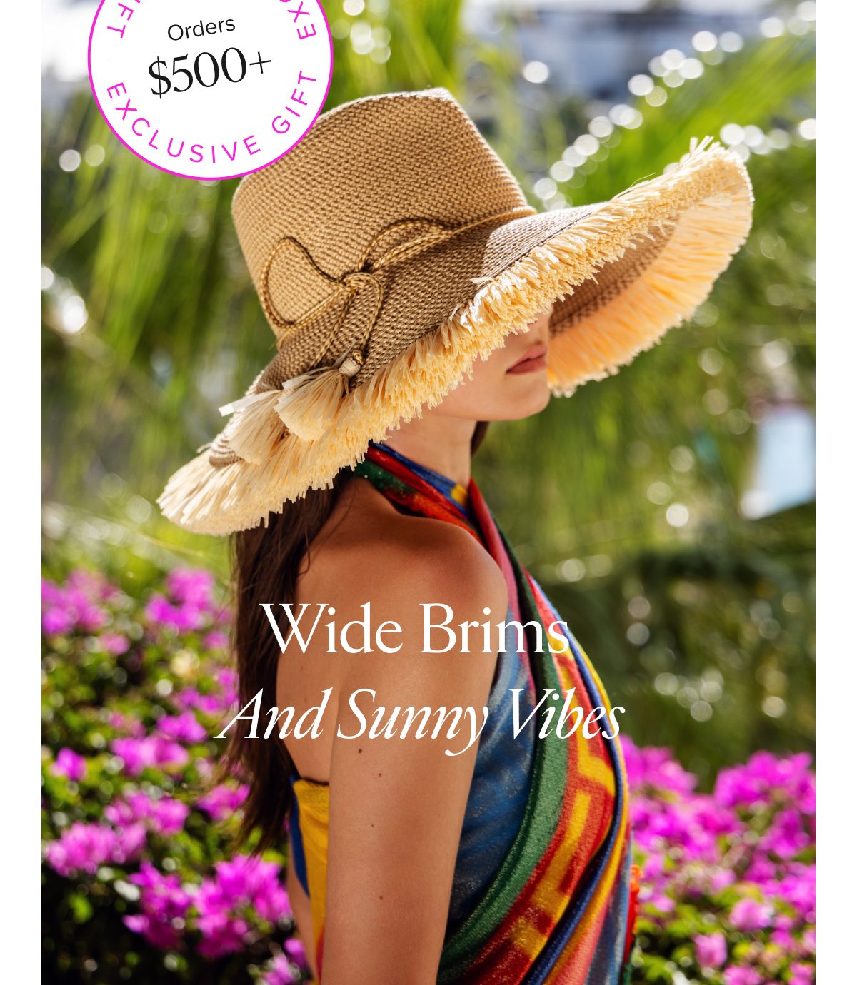 Wide brims and sunny vibes with a model wearing a large hat and colorful wrap, surrounded by flowers.