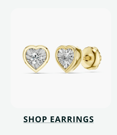 Pair of gold heart-shaped studs featuring a central diamond. Click here to shop earrings