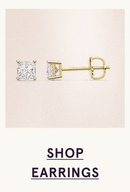 A pair of gold diamond stud earrings. Click here to shop earrings