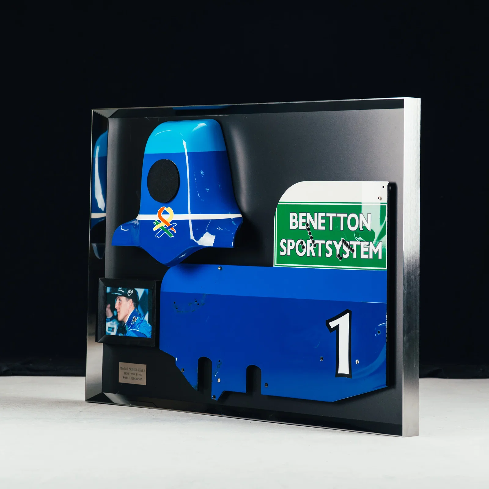 Image of LOT 016 - Michael Schumacher 1995 Benetton B195 Head Rest & Rear Wing Right-Hand Endplate –  Signed Framed