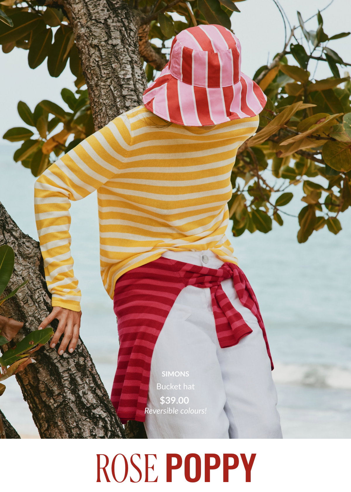 Reversible striped bucket hat in pink and poppy red for $39.00