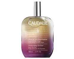 Caudalie Moisturising Oil Elixir glass bottle, purple-to-gold gradient, 100ml, argan and grape oil skincare product