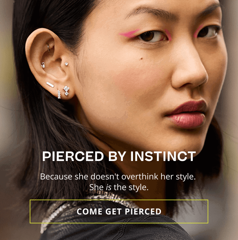 Model with winged eyeliner & modern, geometric diamond ear stack. Pierced by instinct. Click here to come get pierced