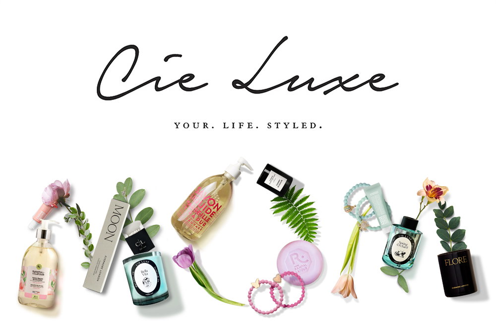 a white background with flowers and perfume bottles