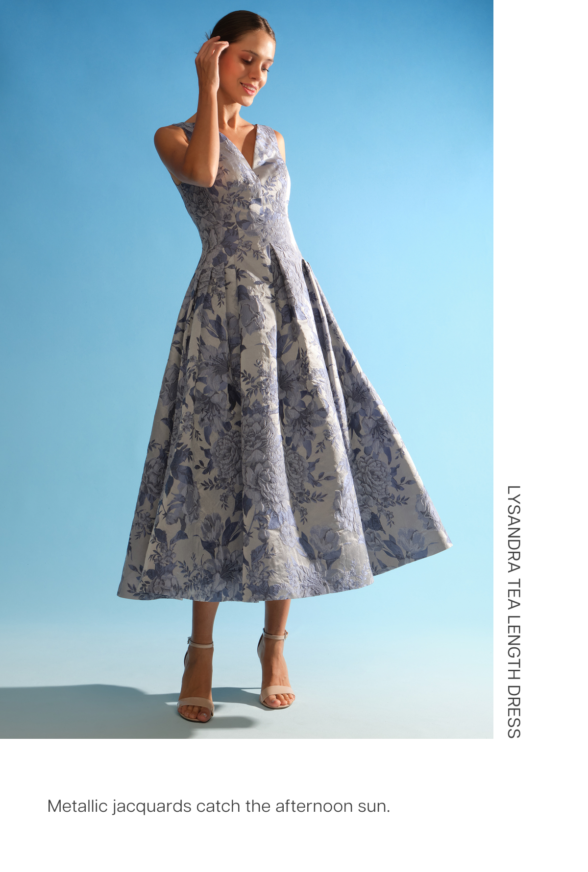 Metallic jacquards catch the afternoon sun. Shop the Lysandra Tea Length Dress
