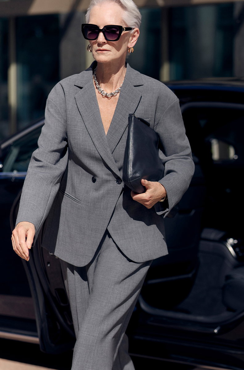 Woman wearing Waisted Double Breasted Longline Blazer in Grey and Pleat Front Carrot Leg Trousers in Grey
