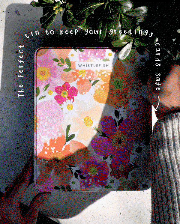 Animated floral keepsake tin designed for storing greeting cards, stationery and treasured little items. Bright floral Petal Pop tin shown in natural sunlight with handwritten overlay text.