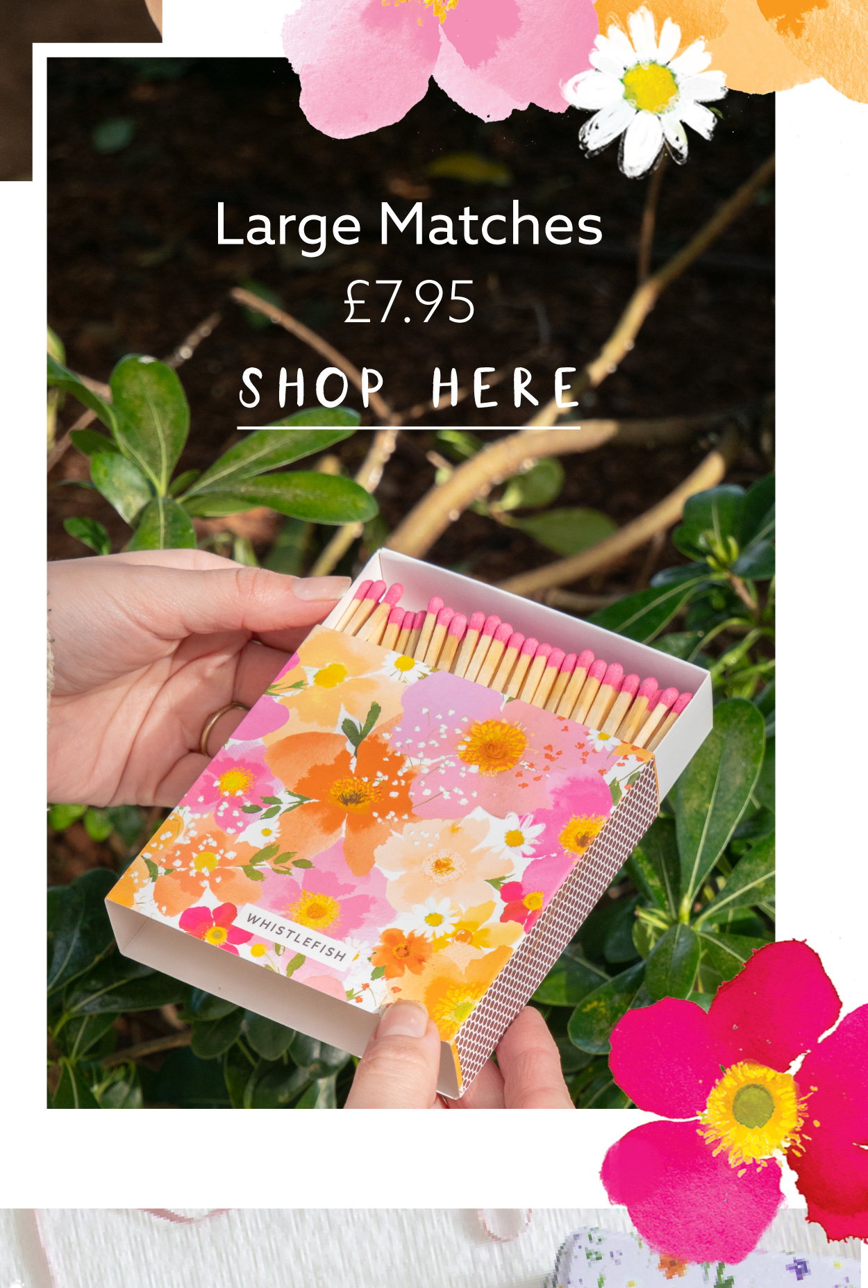 Petal Pop large floral matchbox held outdoors among greenery. Decorative long matches in a bright floral keepsake box for candles, firesides and gifting.