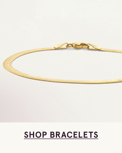 A gold herringbone bracelet. Click here to shop bracelets