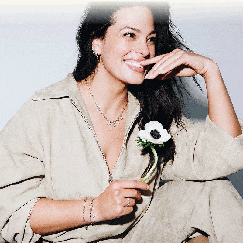 Rotating images of model Ashley Graham wearing gold and diamond jewelry.