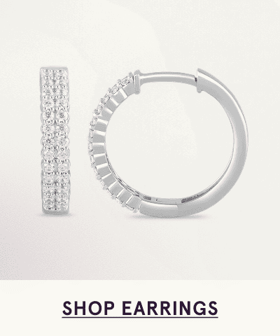 A pair of white metal multi diamond hoops. Click here to shop earrings