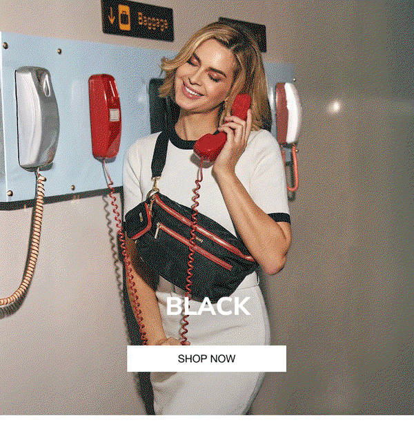Black. CTA: Shop now. Model with charles in black red zip gold. 