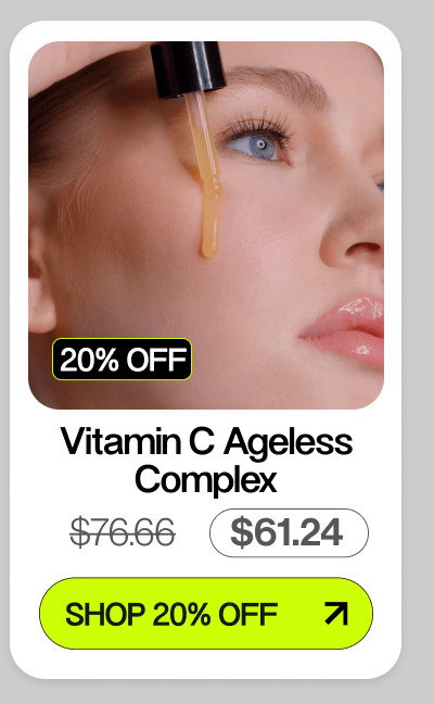 women placing yellow serum on her face