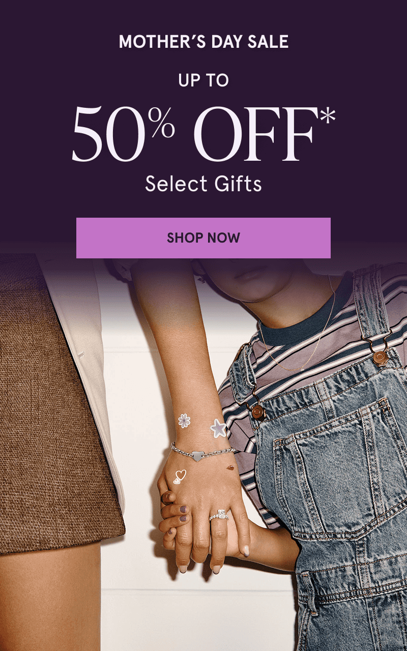 Child holding a parent’s hand clad in jewelry and stickers. Up to 50% off select gifts. Click here to shop Mother’s Day sale