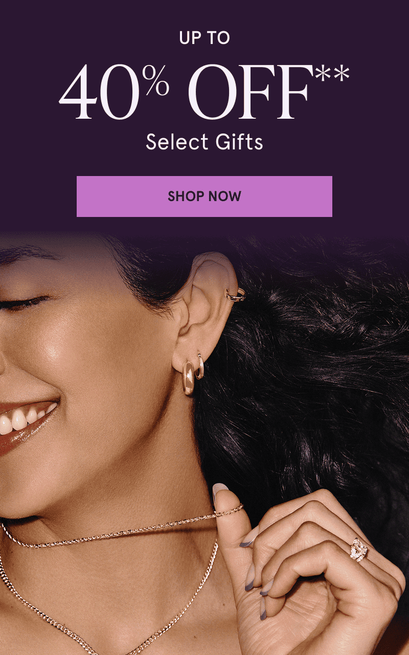 Model in assortment of gold chains & hoops. Up to 40% OFF Select Gifts. Click here to shop now