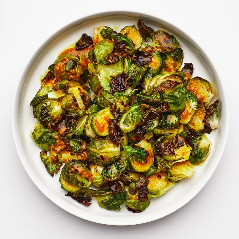 Image may contain: Plate, Food, Produce, Vegetable, Plant, and Brussel Sprouts