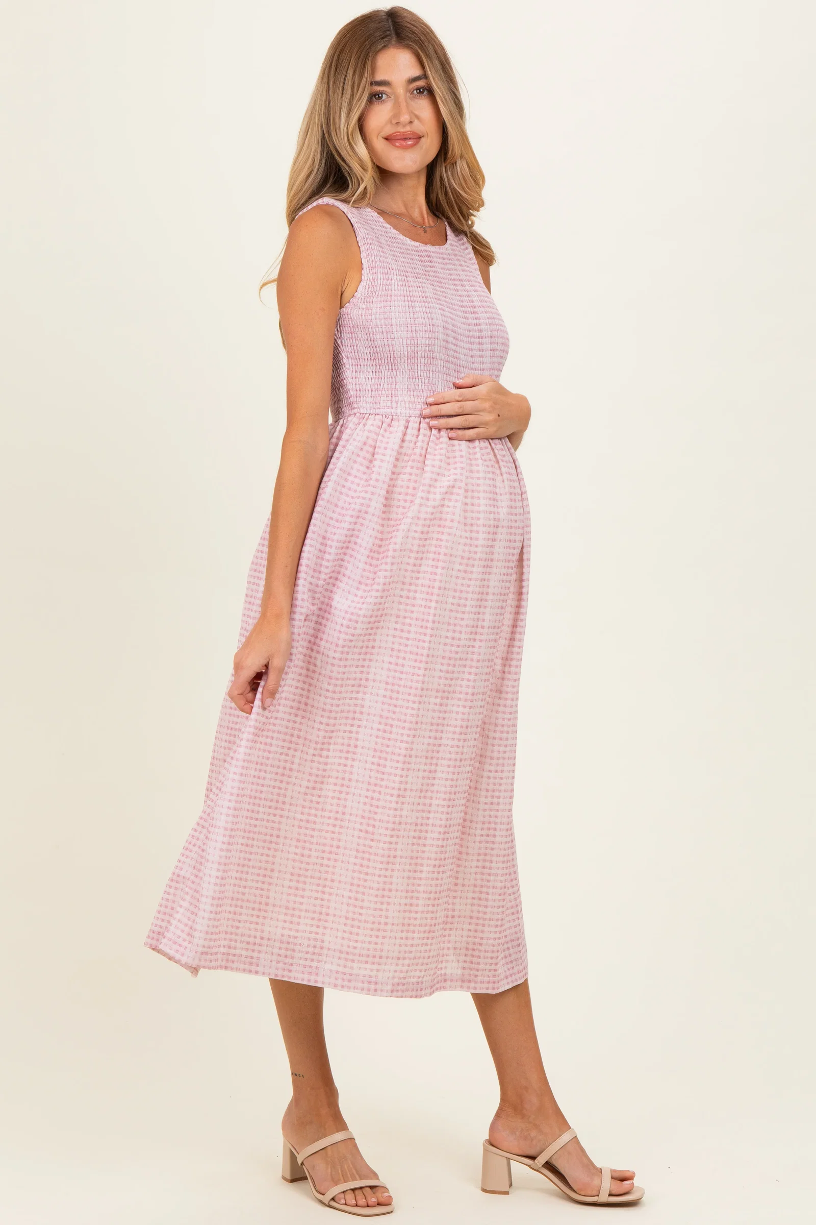 Image of Blush Gingham Sleeveless Smocked Maternity Midi Dress