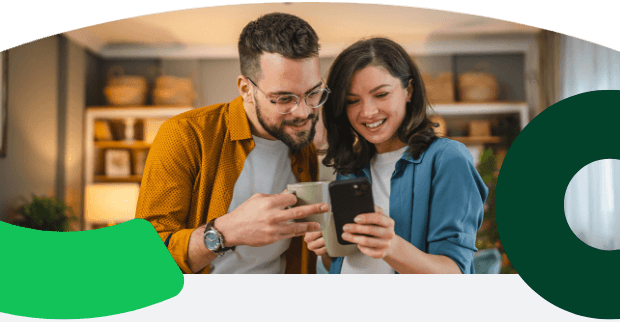 Two friends smiling at a phone