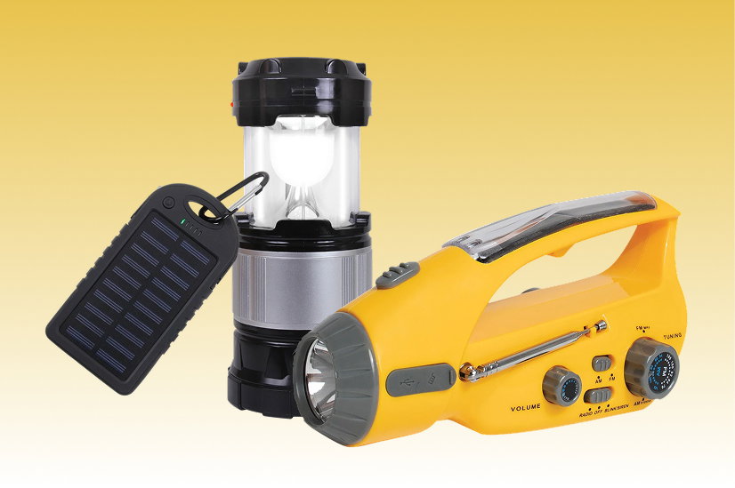 Emergency preparedness tools on a yellow gradient background: a solar-powered portable charger, a collapsible LED camping lantern, and a yellow hand-crank emergency radio with built-in flashlight