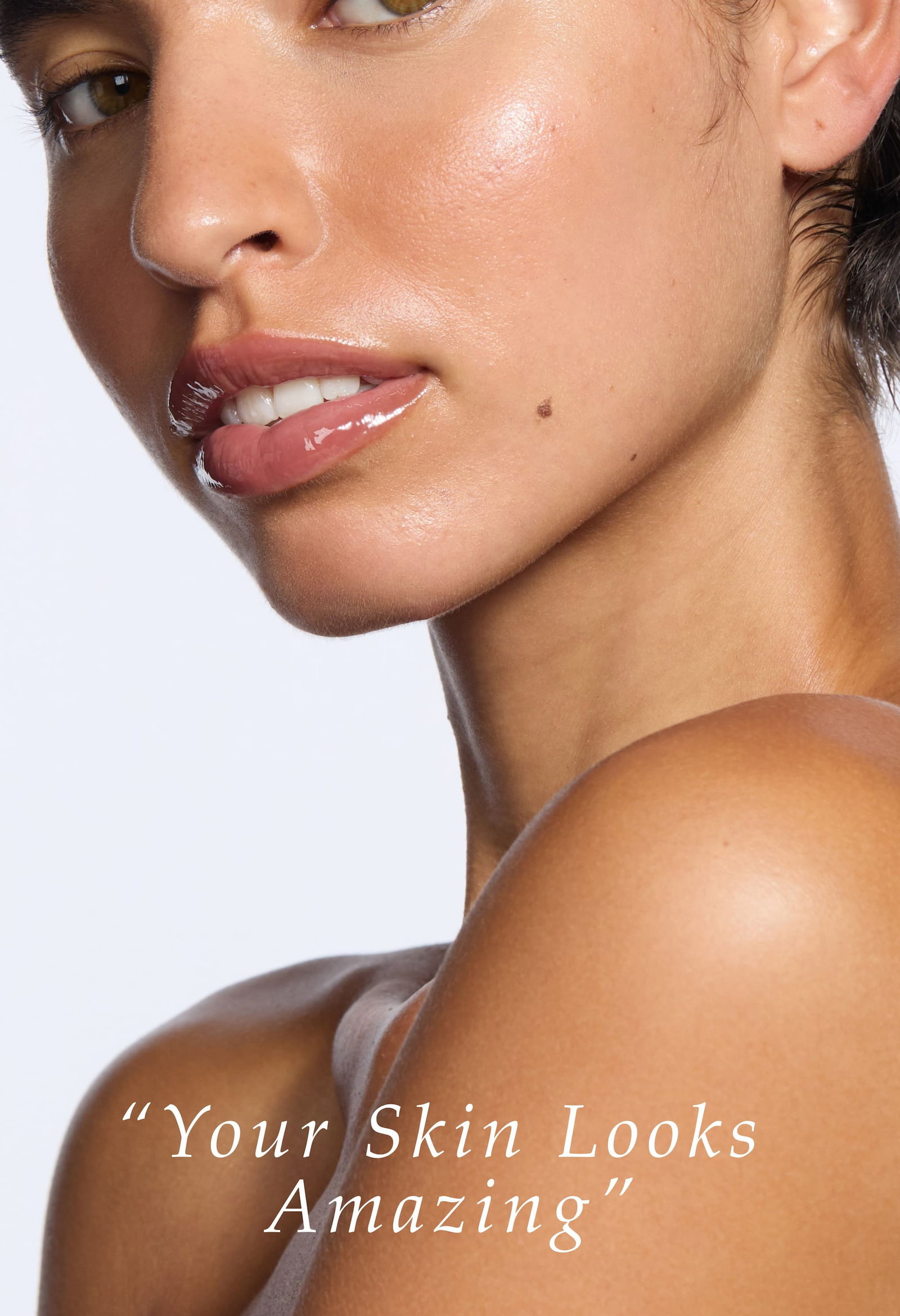 S'ABLE Labs model with luminous, natural skin finish and glossy lips, highlighting skin health and glow