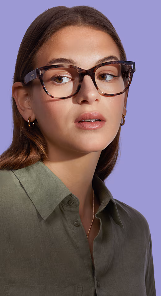 A woman in light cat-eye glasses