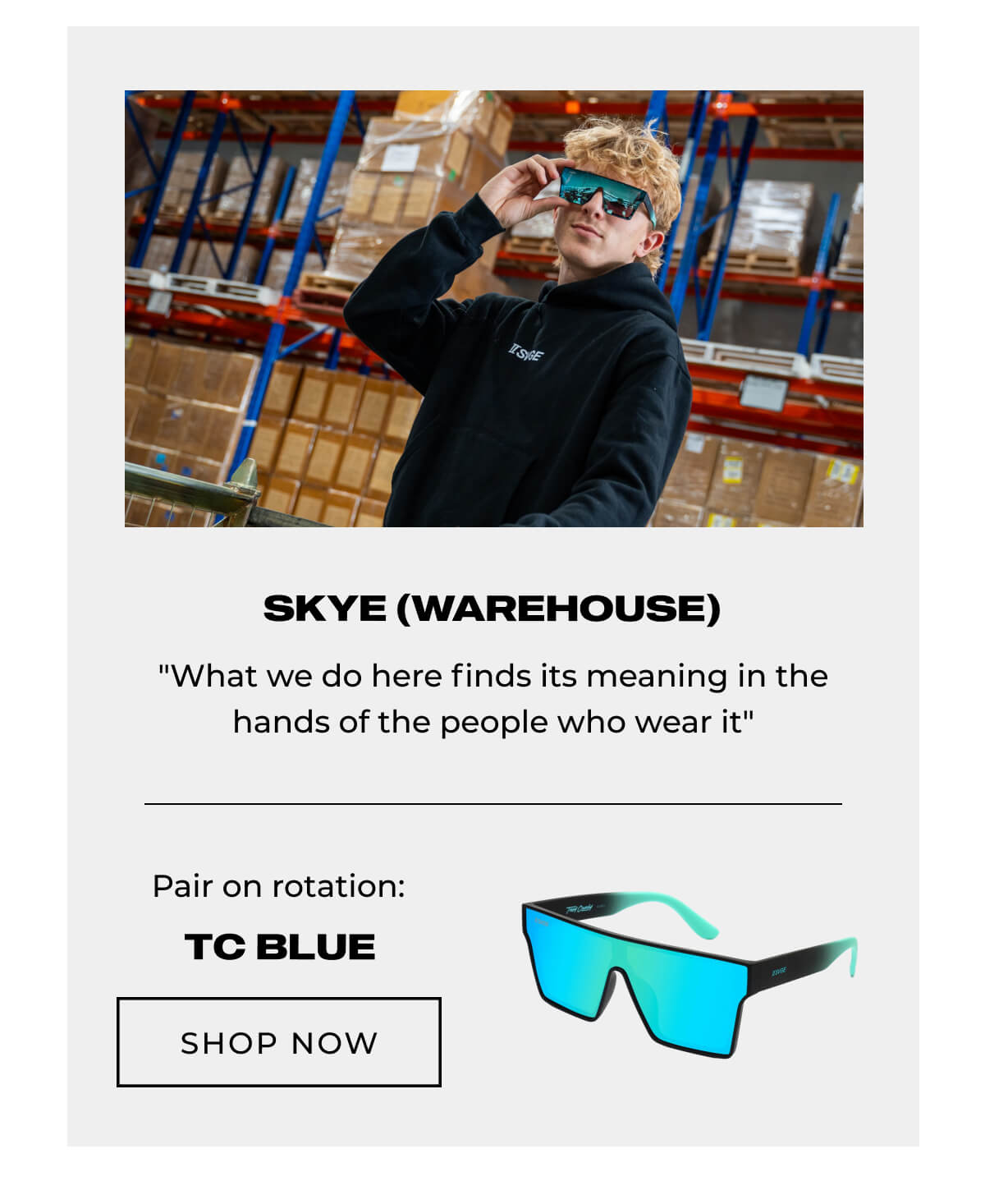 Skye in warehouse wearing blue sunglasses and black Svge hoodie. Tc Blue sunglasses model shown below